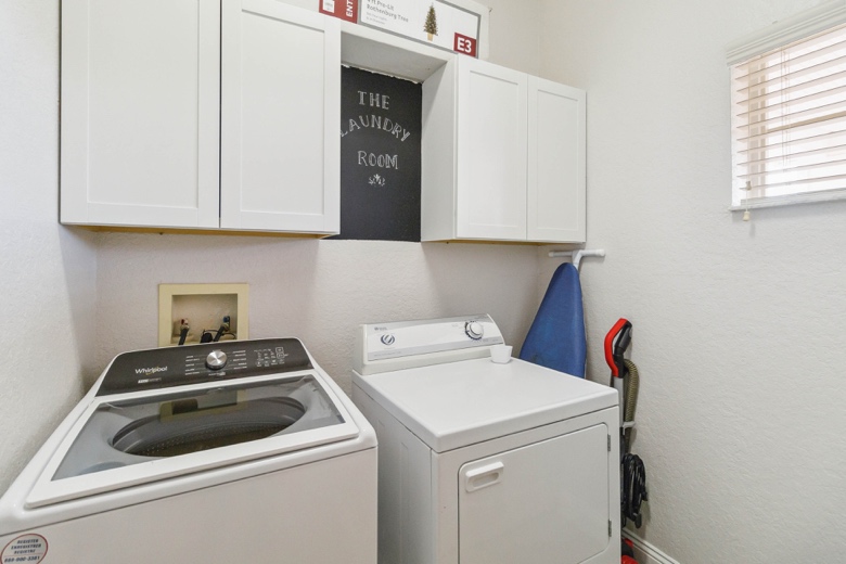 Dedicated laundry room with washer and dryer