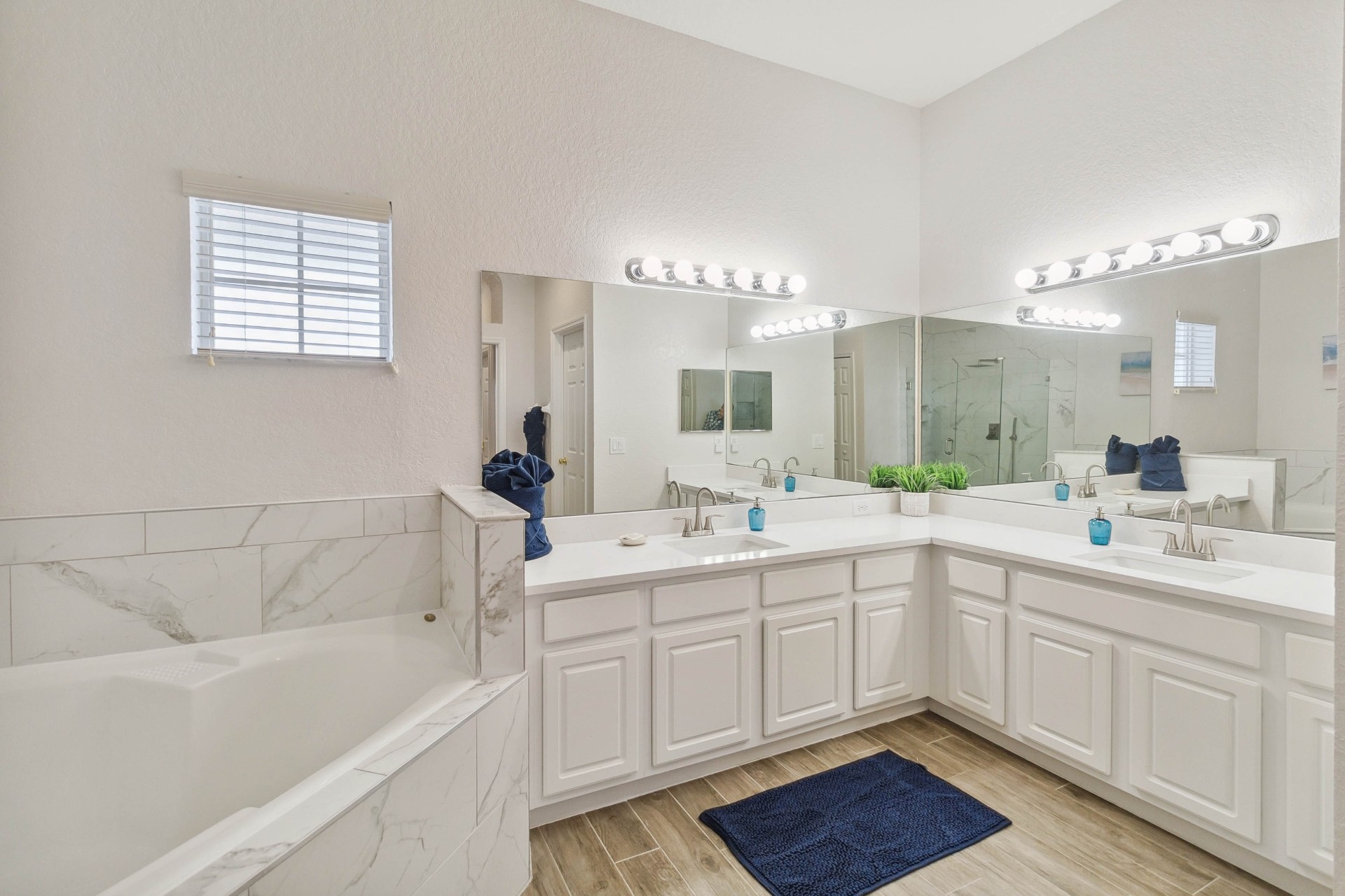 Master en-suite with double vanity and marble tub