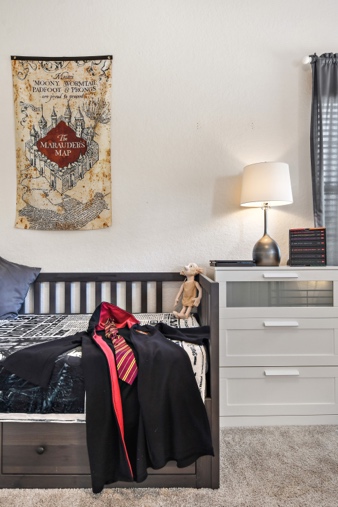 Harry Potter bedroom with Marauder's Map and Gryffindor robe